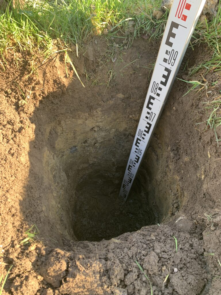 Percolation test hole with surveying rod — field soil evaluation for IWS design per HAR Chapter 11-62